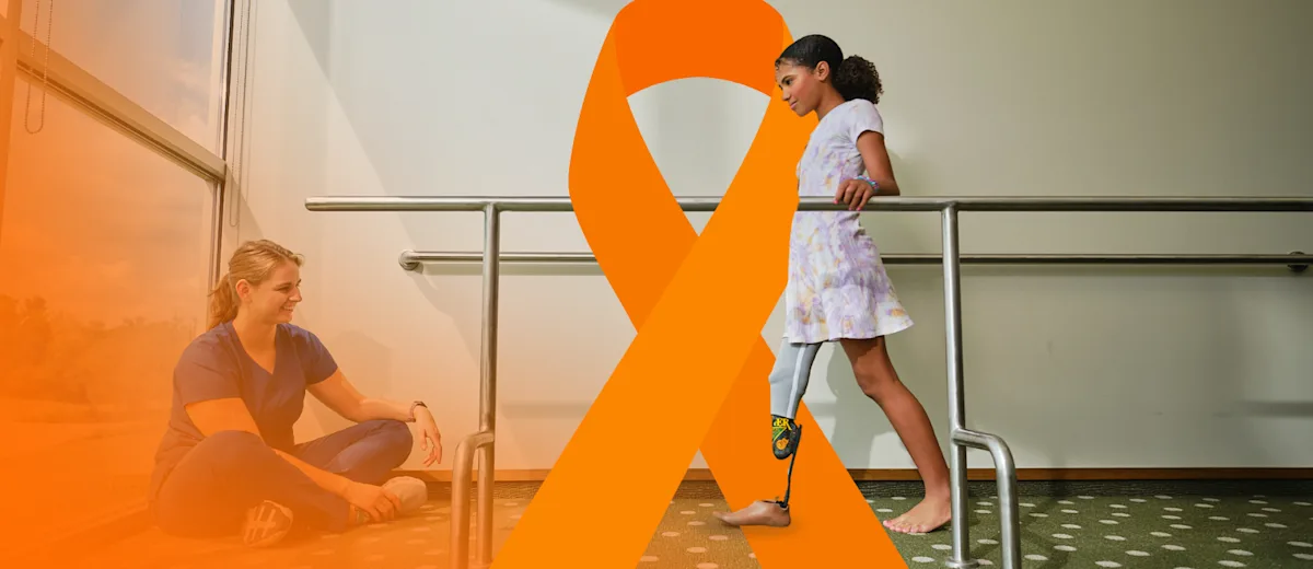 A certified prosthetist orthotist (CPO) assessing a child's prosthetic device by observing their gait