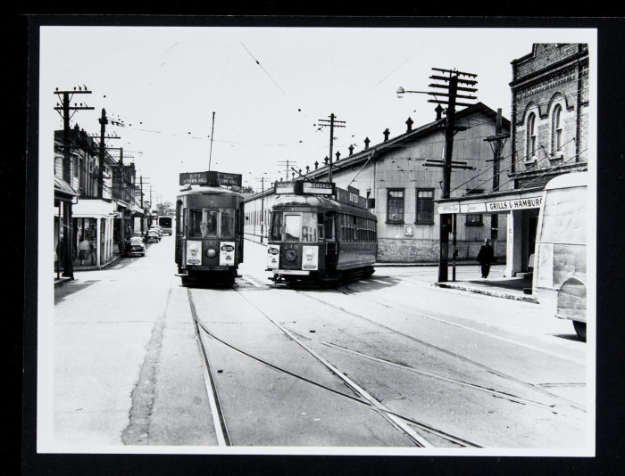 Graham Stewart. 1954-1955. [Trams 181 and 248 in Manukau Road with the Epsom Tram sheds behind at the intersection of Balmoral Road and 248 turning out of Greenlane Road and bound for Onehunga]. PHO-2020-19.434.  Walsh Memorial Library, The Museum of Transport and Technology (MOTAT).  