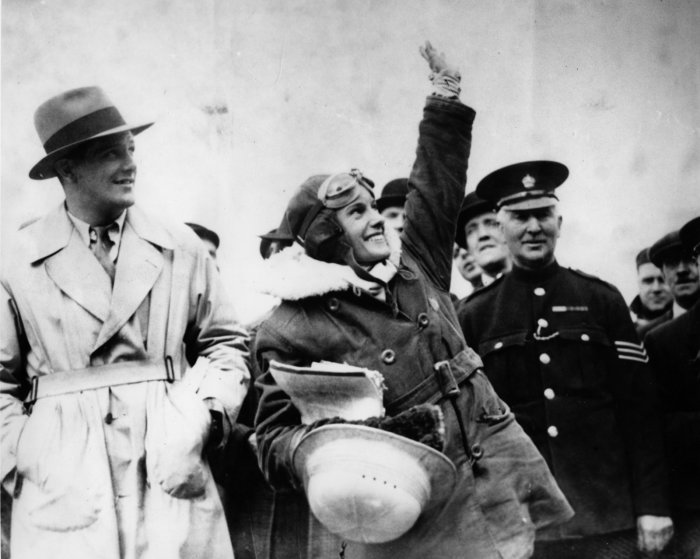 Unknown photographer. [29 Apr 1935]. [Jean Batten waving to supporters during after arrival in Croydon], PHO-0192–1.24. Walsh Memorial Library, The Museum of Transport and Technology (MOTAT). No known copyright restrictions.
