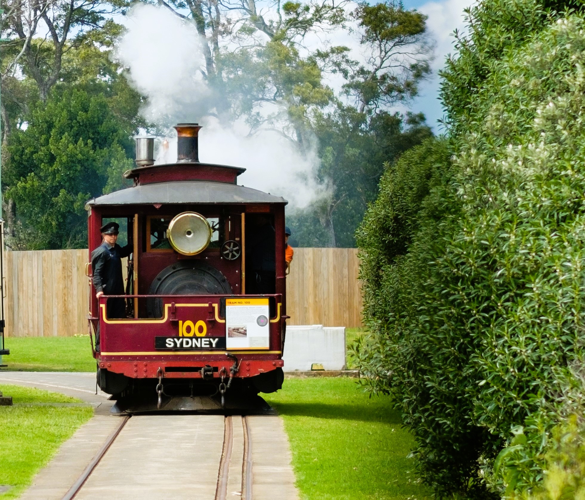 Tram No.100 puffs along the track