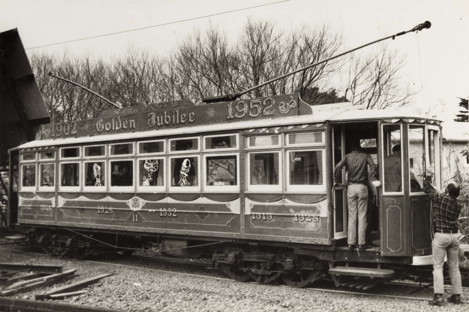 Graham Stewart. 1970s. [Preserved tram no. 11 with Golden Jubilee decorations at MOTAT. Tram 11 is seen here having its first test runs at the lower tram shelter - where the lower tram barn building now stands], PHO-2017-5.34. Walsh Memorial Library, The Museum of Transport and Technology (MOTAT).