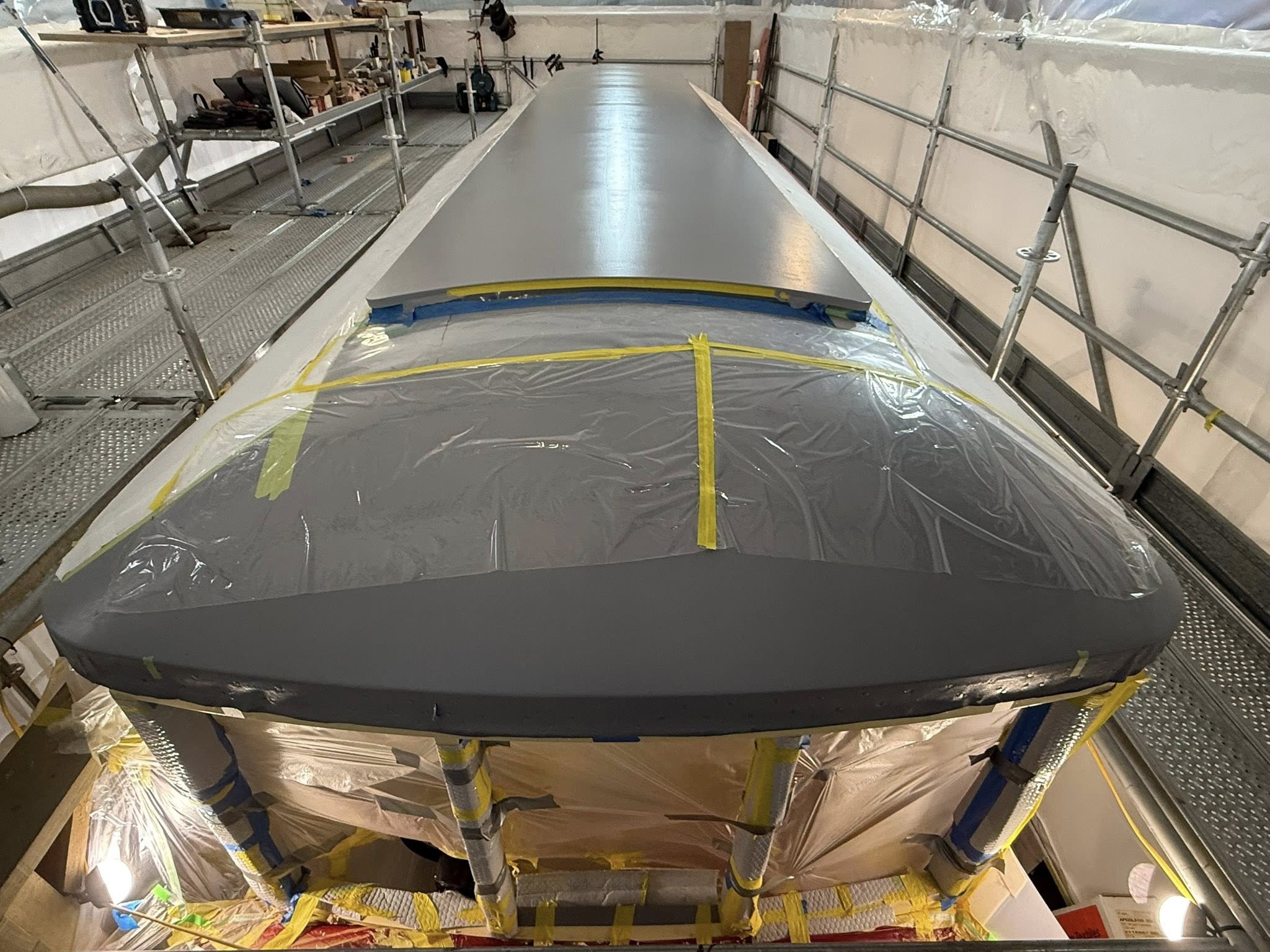 After fairing and sealing, the monitor roof is primed with Durapox and the canvas installed along with several coats of marine grade waterproof paint, exactly the same process as the main roof.