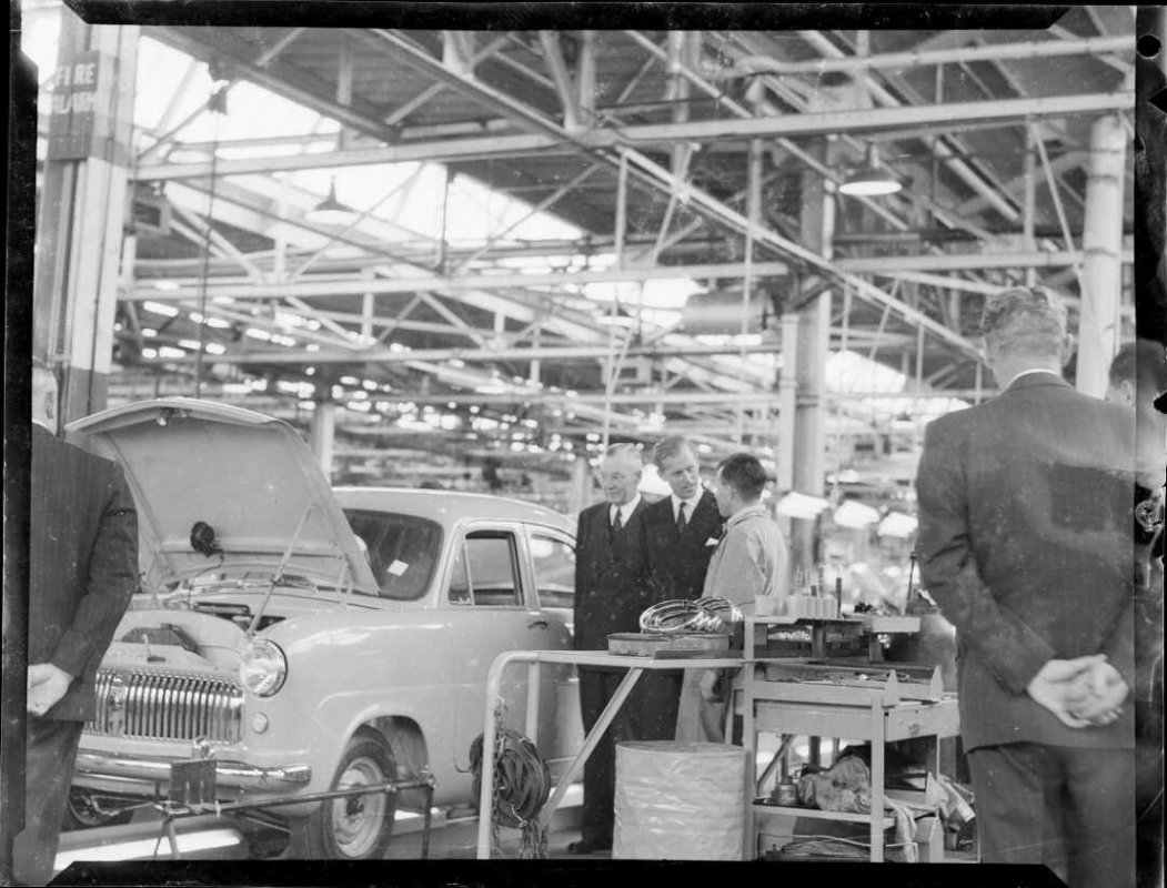 The Duke of Edinburgh inspecting a car at the Ford Motor Company factory, Lower Hutt, Royal Tour, 1953–1954. 