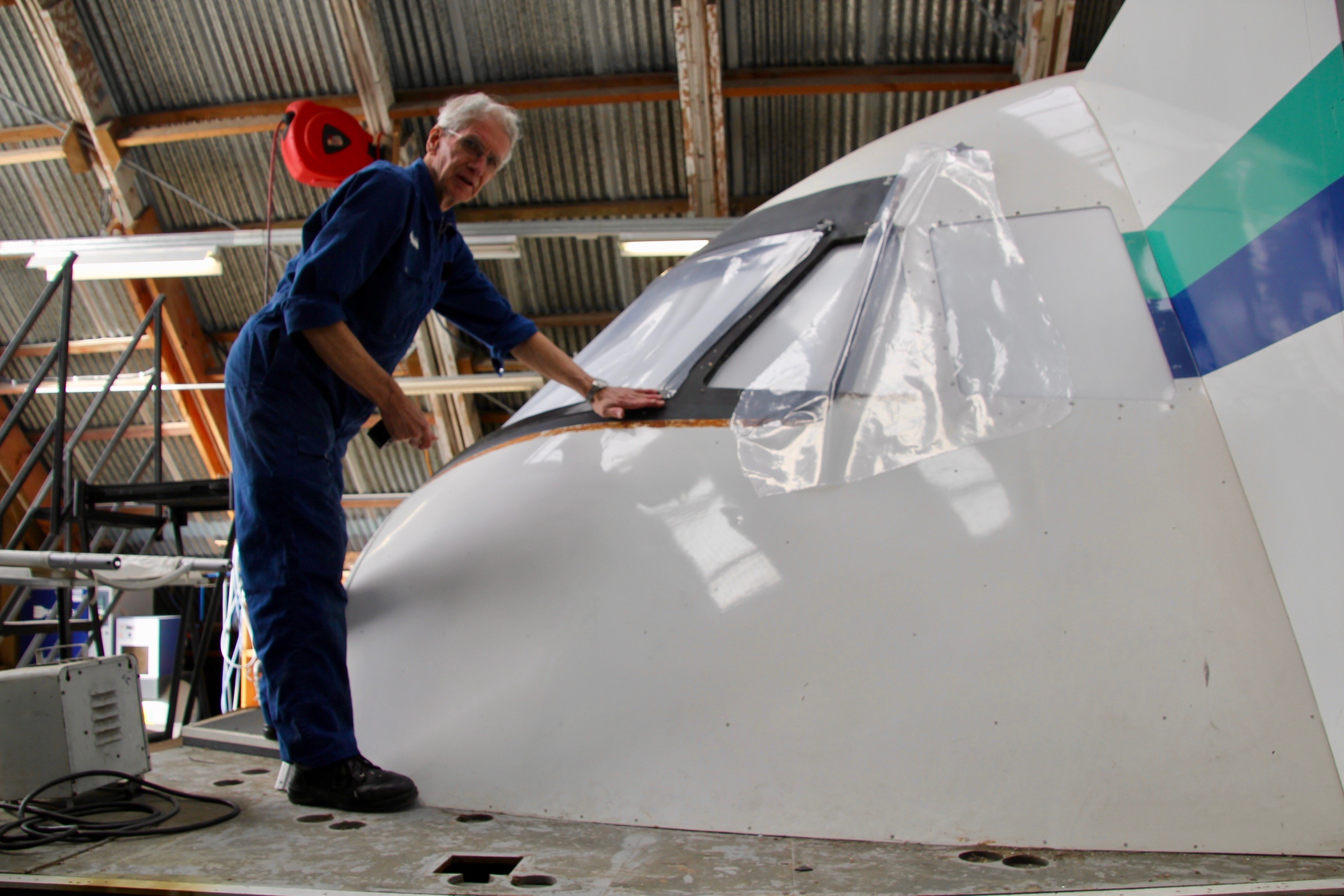 Volunteer Peter Kelly working on the aircraft simulator