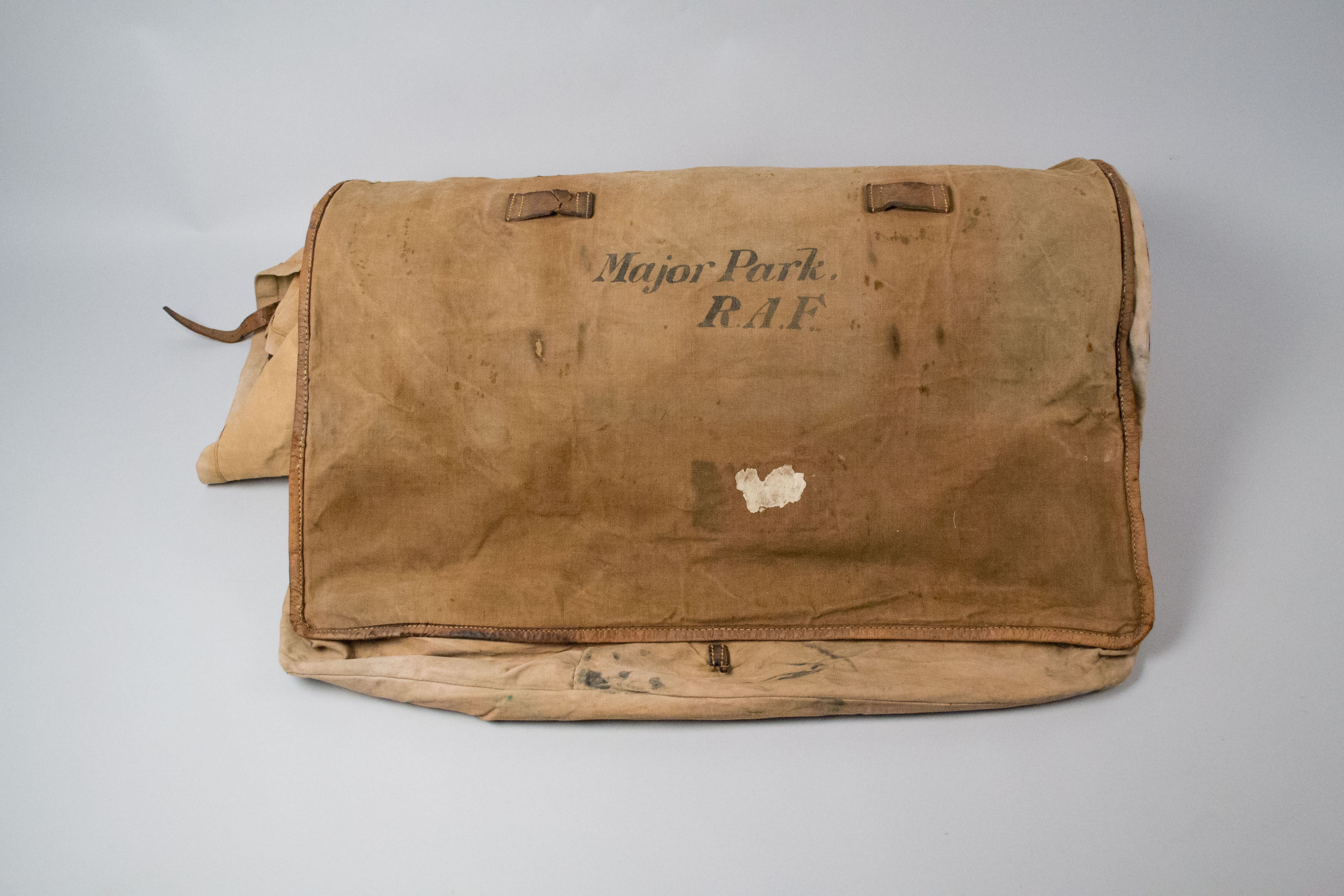 Image: Senior Conversation Technician removing corrosion from the coveralls, The Museum of Transport and Technology (MOTAT).