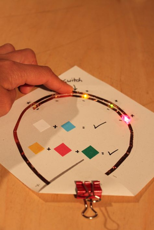 Makey makey electronics with LED lights and paper circuits