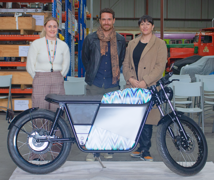 MOTAT's Transport Curator Chelsea Renshaw (left) with, Michel Roncara, FTN Motion's General Manager and Janine Williams who created the bespoke artwork for the museum's Streetdog.