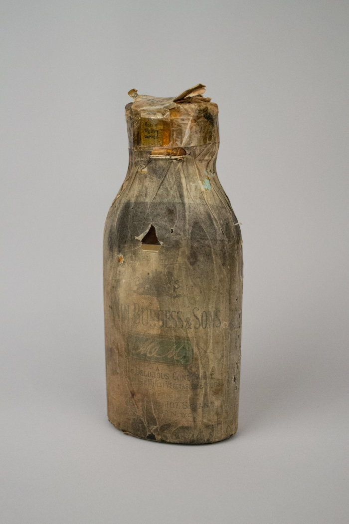 Front of bottle. John Burgess & Sons. 1910. Sauce Bottle [Essence of Anchovies], 2017.23.2. The Museum of Transport and Technology (MOTAT). URL: https://collection.motat.org.nz/objects/102160.