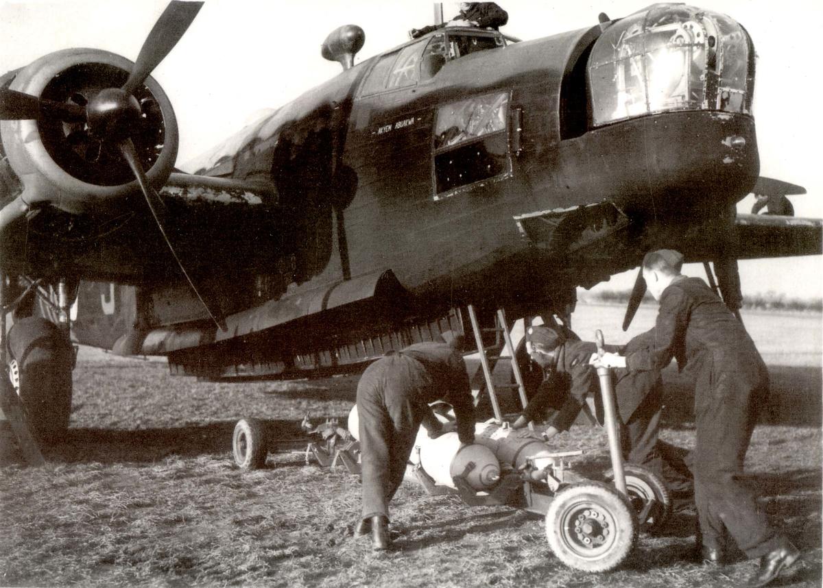 Wellington airplane being loaded with bombs