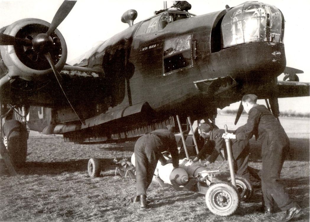 Wellington airplane being loaded with bombs