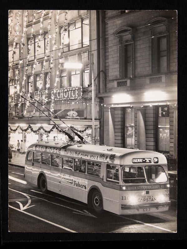 Graham Stewart. Dec 1958. [Trolley bus 110 on Queen Street at night], PHO-2020-19.620. Walsh Memorial Library, The Museum of Transport and Technology (MOTAT).