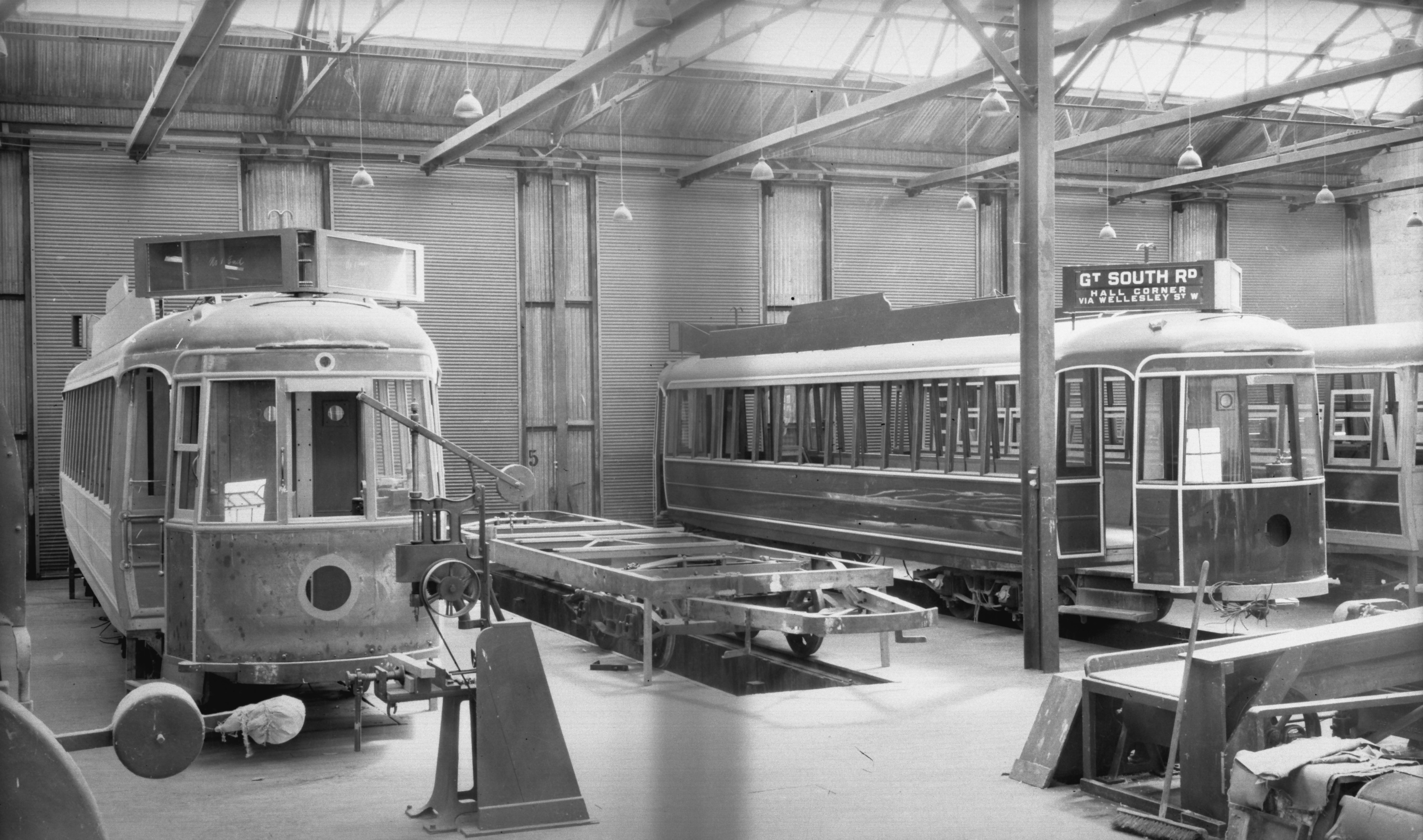 Victor Gibbon. Circa 1937 – 1938. Four of the six 1937-class Streamliners including No.248 being built by the Auckland Transport Board in their Manukau Road Workshops. Supplied by David Cawood from the Graham Stewart Collection. 