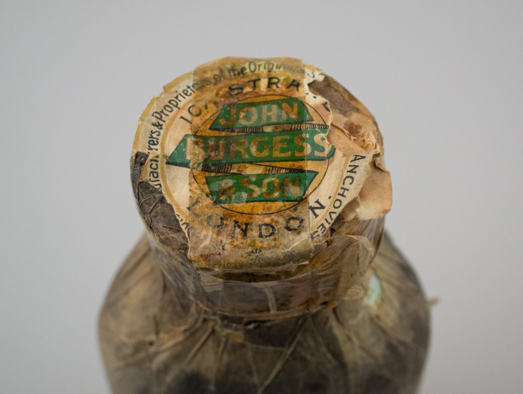 Top of bottle. John Burgess & Sons. 1910. Sauce Bottle [Essence of Anchovies], 2017.23.2. The Museum of Transport and Technology (MOTAT). URL: https://collection.motat.org.nz/objects/102160