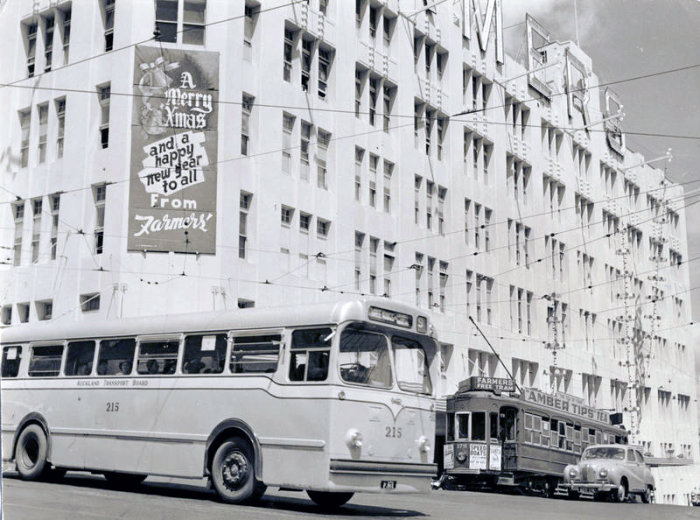 Graham Stewart. 30 Apr 1954. [Farmers Free trolley bus 215 and tram 178 outside Farmers Department Store at Christmas], PHO-2020-19.685. Walsh Memorial Library, The Museum of Transport and Technology (MOTAT).