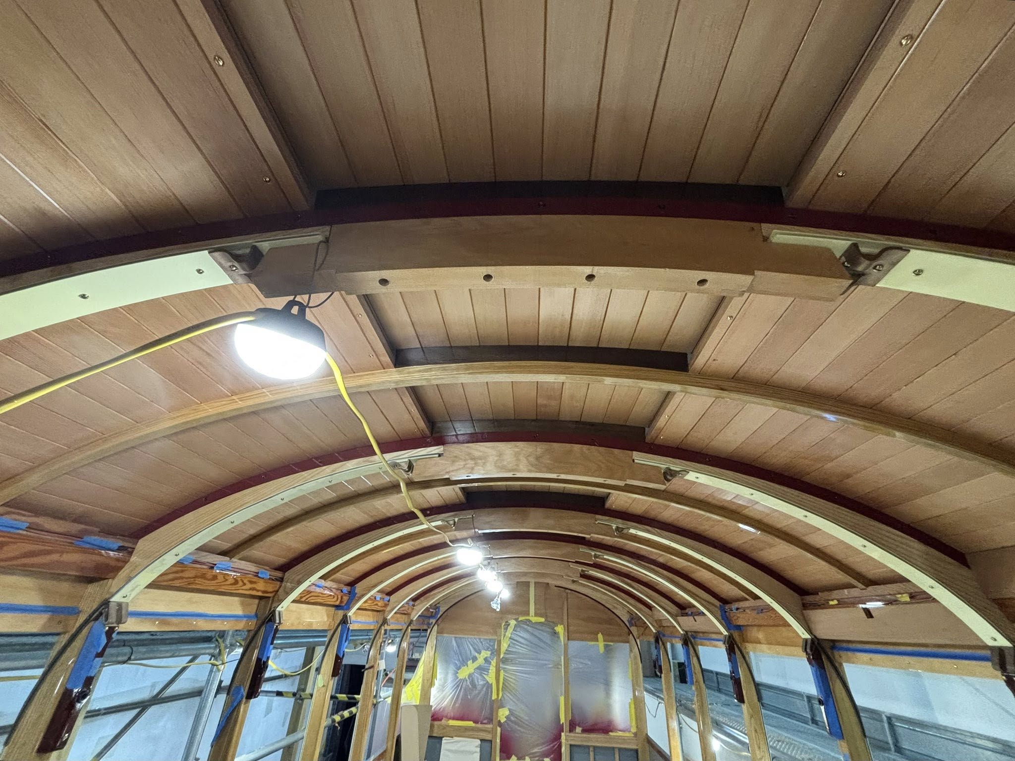 The completed main roof planking and a rare glimpse of the underside of the monitor roof, ultimately concealed by the red cedar and mottled kauri central ceiling