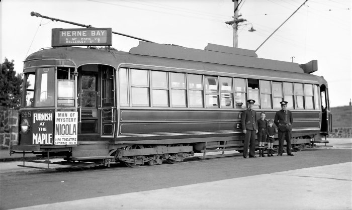 W. W. Stewart. 1938.  No.248 at Three Kings prior to its journey to Herne Bay. Motorman Richard “Dick” Sterling, young Ian and Graham Stewart and Conductor. The tram is in the original Dulux Carnation red colour scheme.  Supplied by James Duncan from the Graham Stewart Collection. 