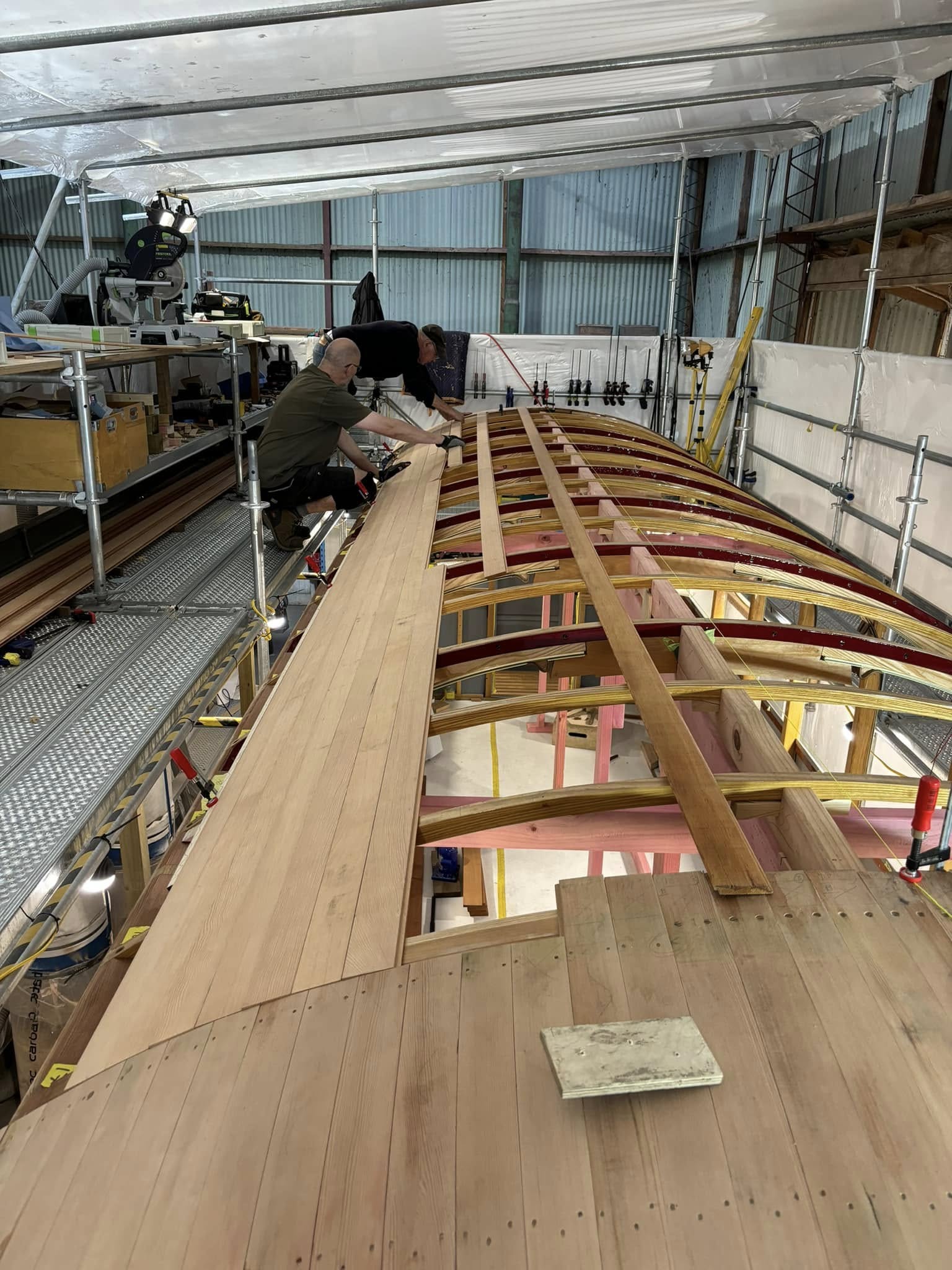 The main coach roof, lap-jointed Oregon planking is installed symmetrically from the edge to centre on each side.