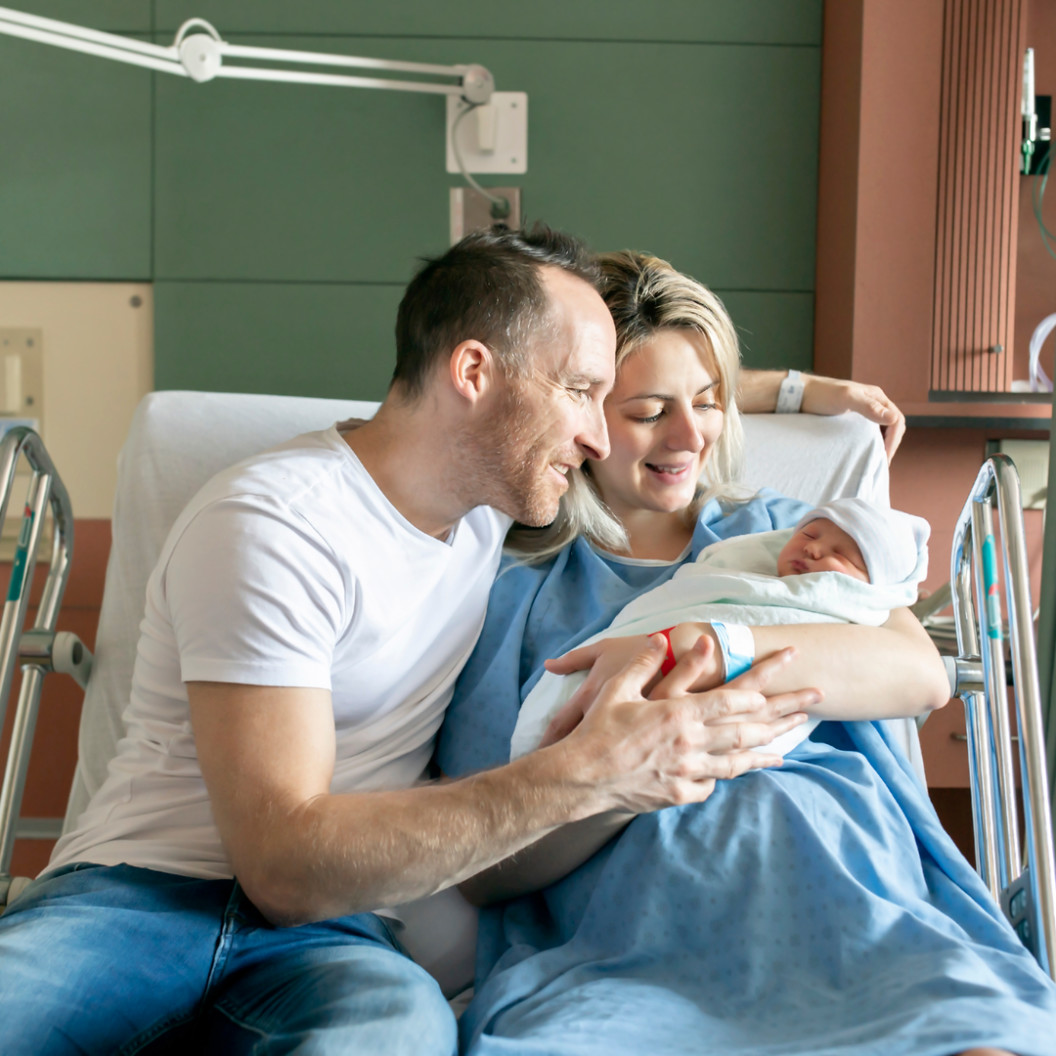 square-a-mother-and-father-with-her-newborn-baby-at-the-hospital-a-day-after-a-natural-birth-labor