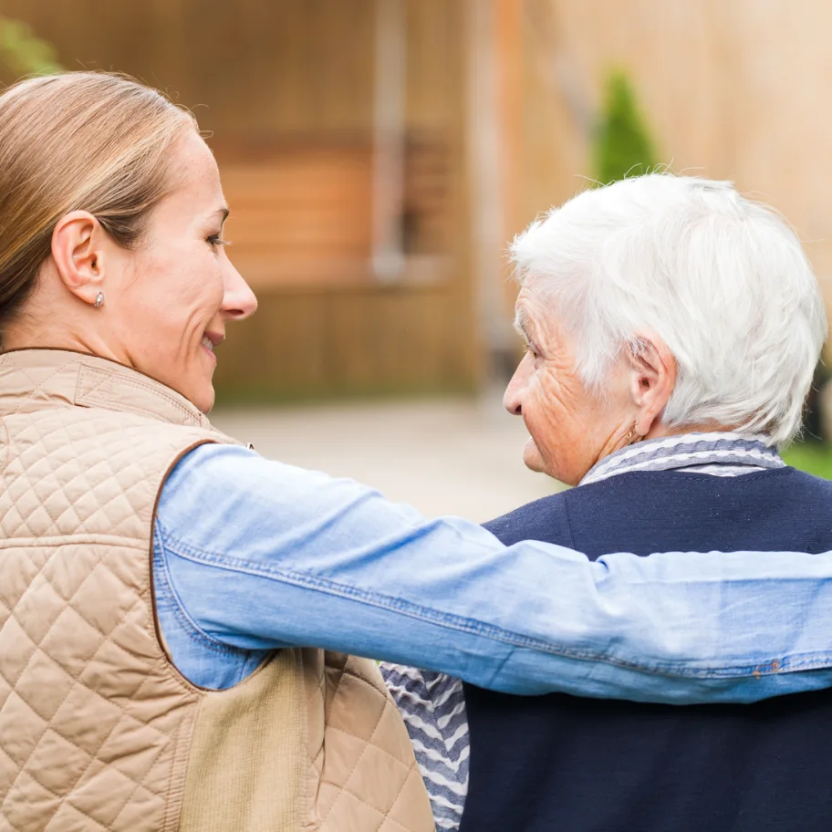 square-young-carer-walking-with-the-elderly-woman-in-the-park