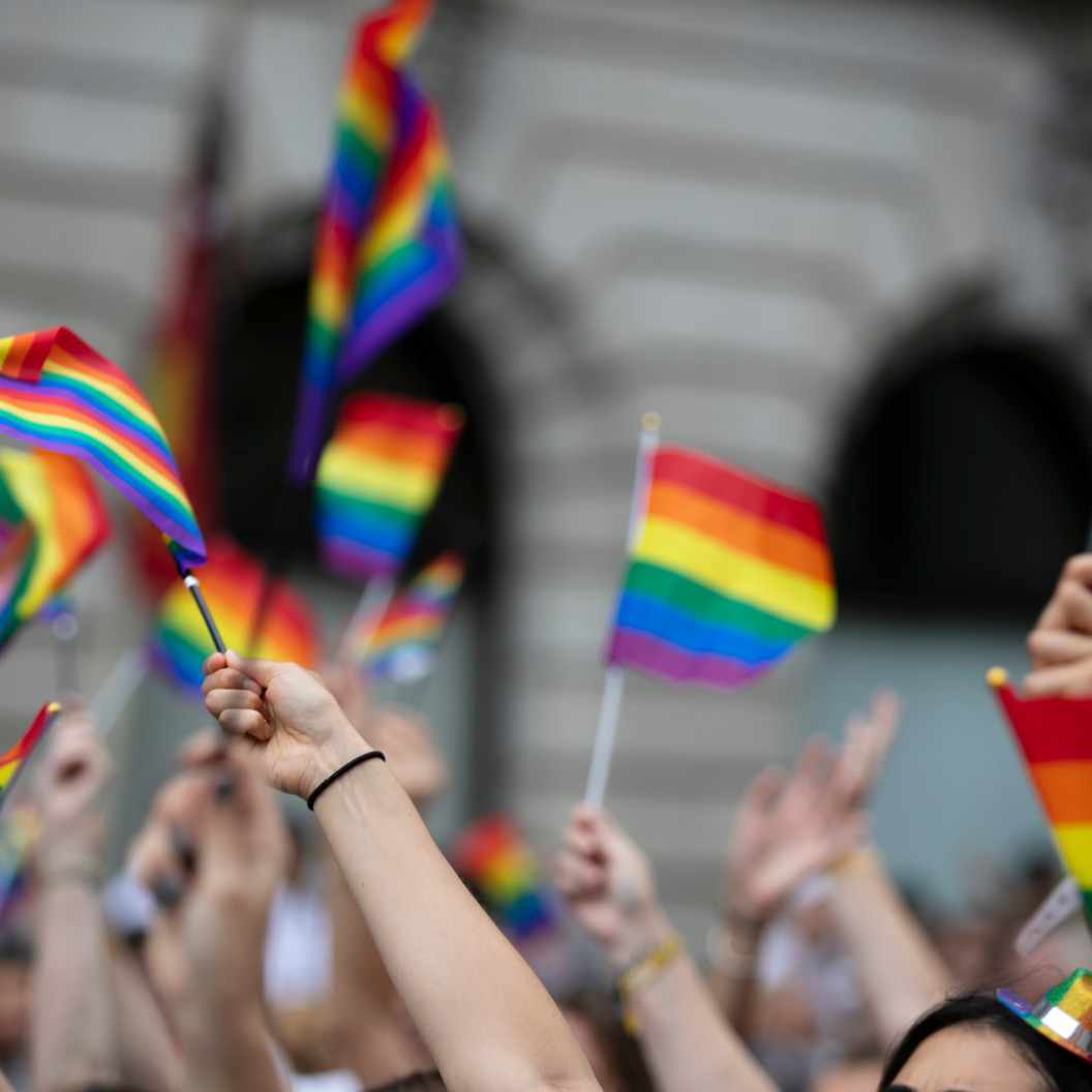 square-crowds-of-people-wave-gay-pride-flags-at-a-solidarity-march