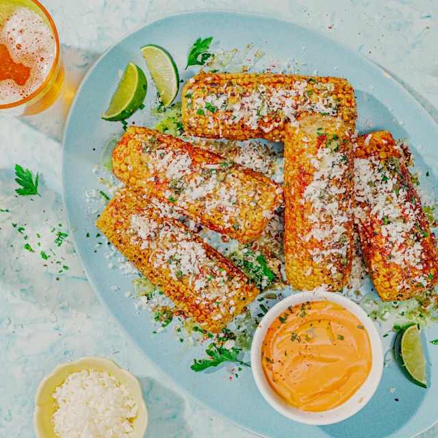 Panotxes a la brasa amb mantega d'all, crema picant i parmesà.
