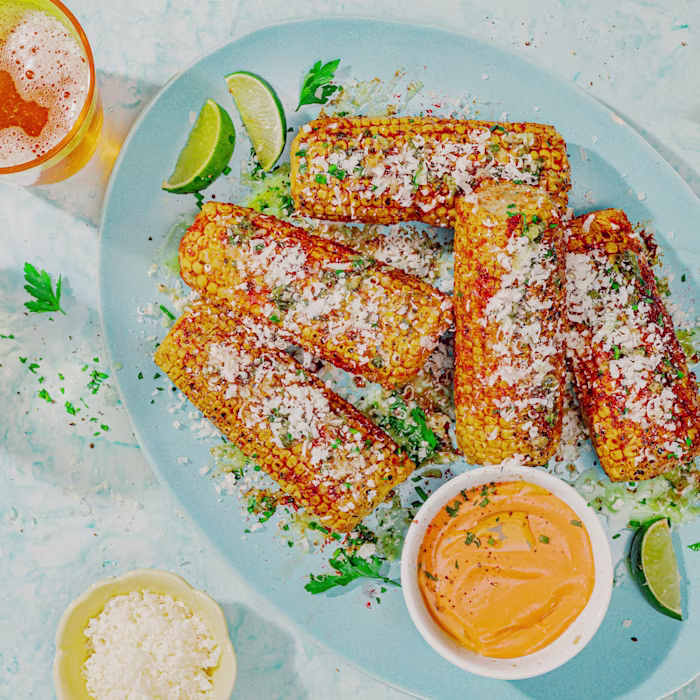 Panotxes a la brasa amb mantega d'all, crema picant i parmesà.