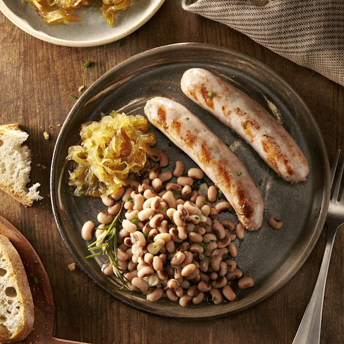 Botifarra amb mongetes i ceba caramel·litzada