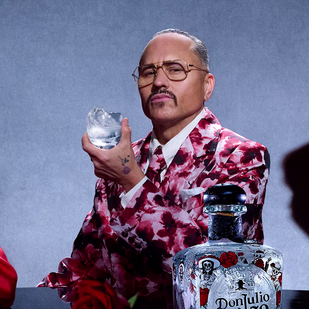 Willy Chavarria holding a Tequila Don Julio 70 Añejo Cristalino on the rocks cocktail