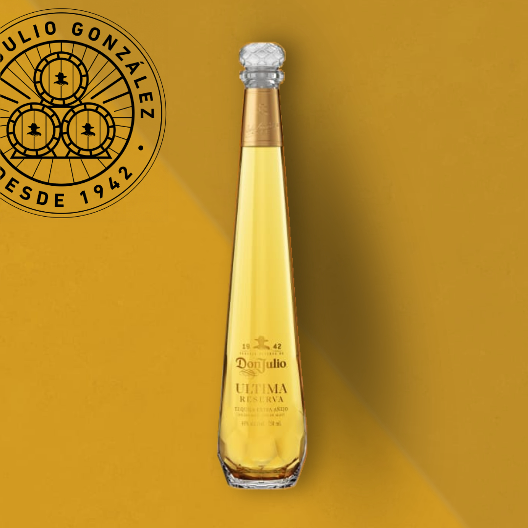 there is a bottle of ultima reserva tequila on a yellow surface