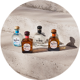 Don Julio Blanco, Añejo, Reposado, & 70 Cristalino lined up on a table