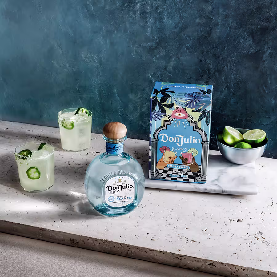 Three Tequila Don Julio Spicy Margarita cocktails around a Tequila Don Julio Blanco Summer of Mexicana Box