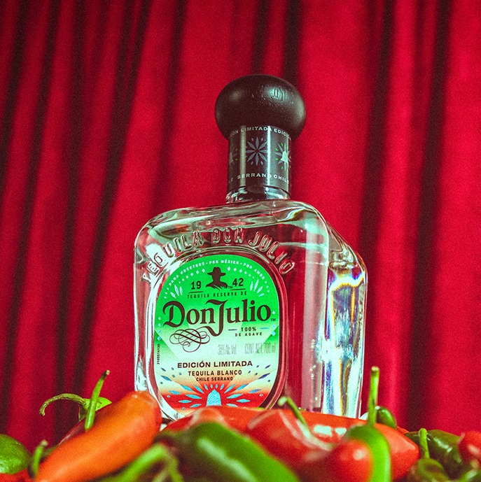 Image of a bottle of Don Julio Tequila Blanco Edición Limitada. The bottle features a sleek, clear design with a label in the colors of the Mexican flag: green, white, and red.