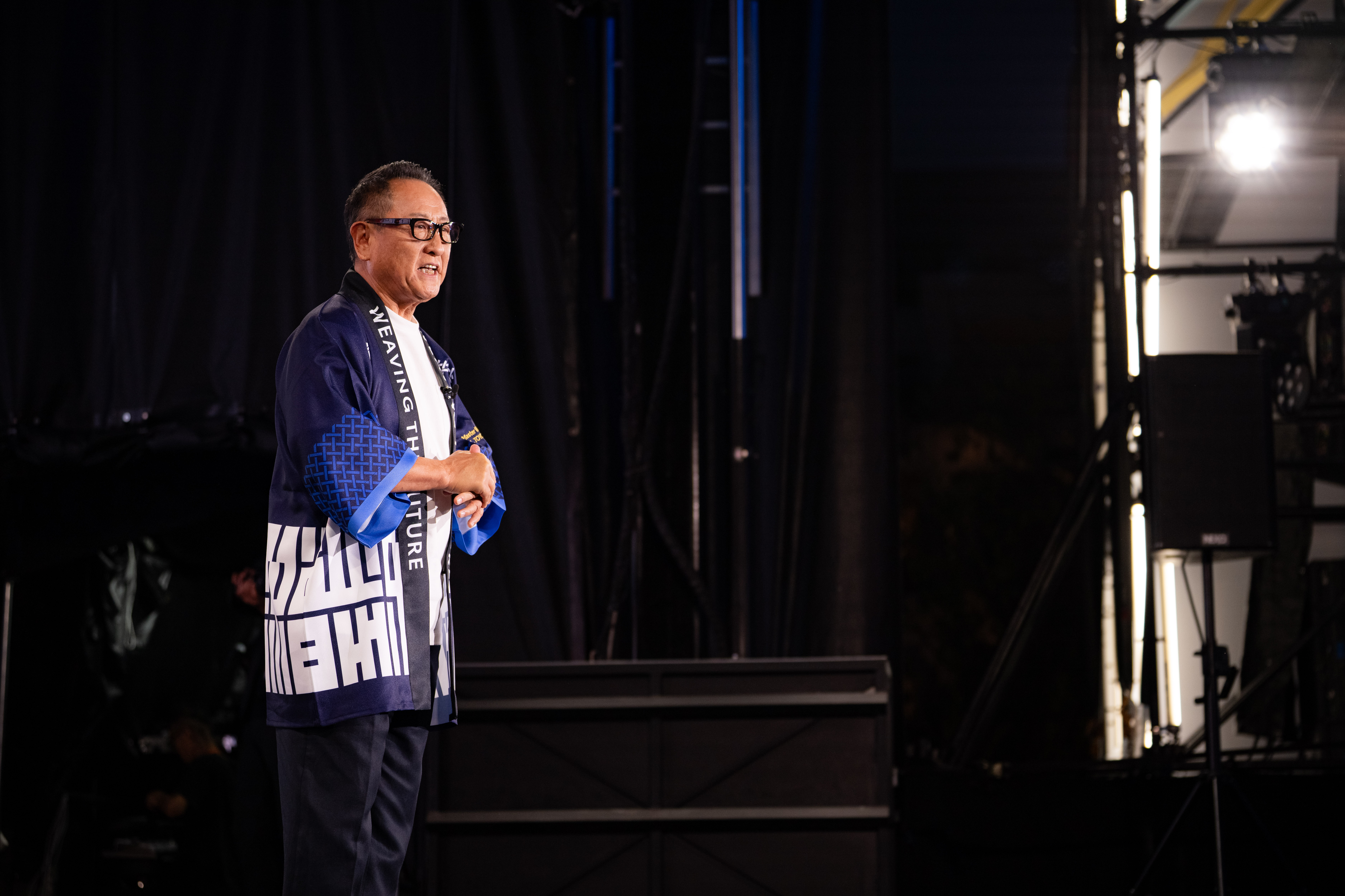 Toyota Chairman Akio Toyoda delivery a speech on stage at Woven City's official launch event