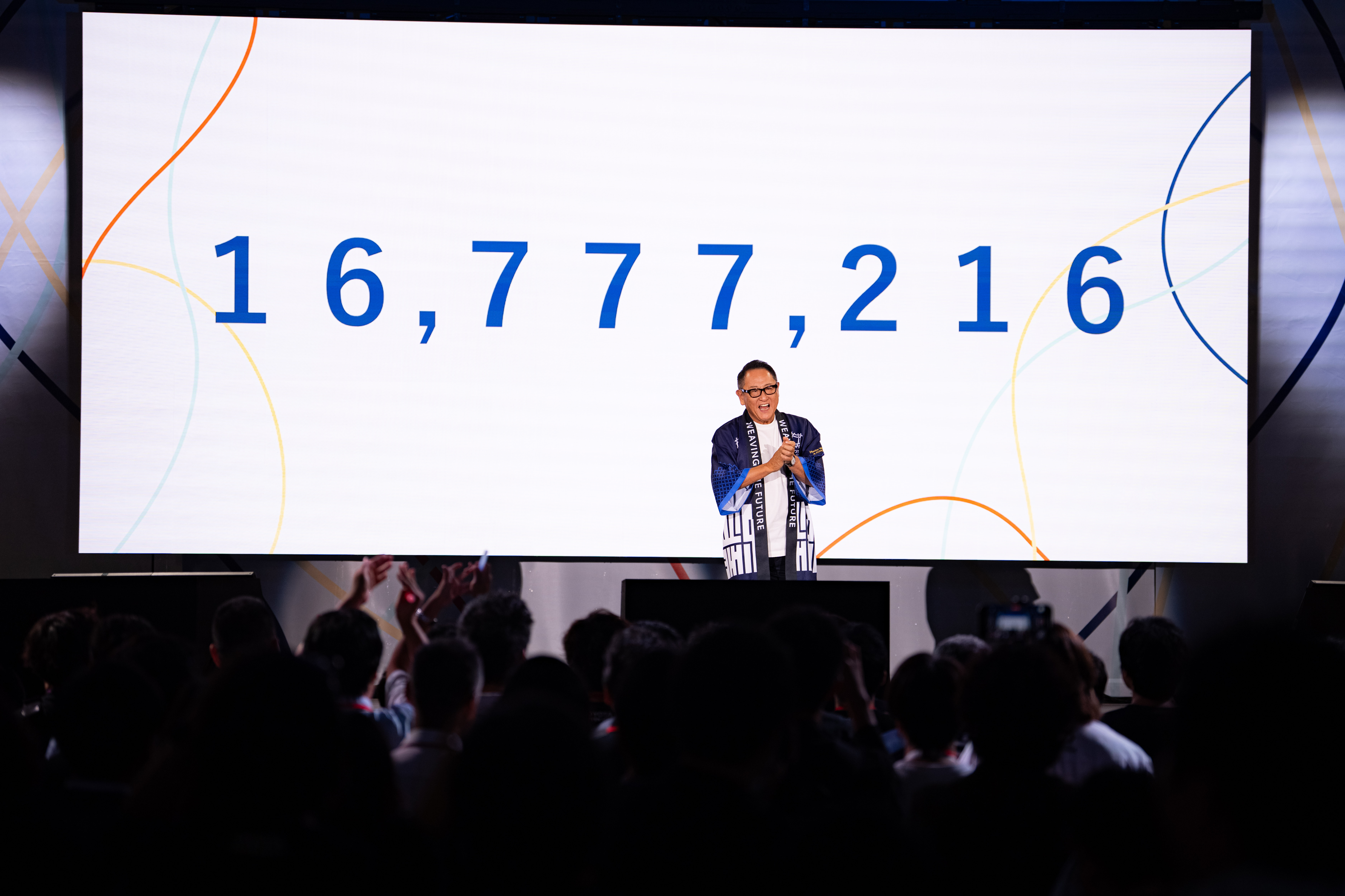 Toyota Chairman Akio Toyoda delivery a speech on stage at Woven City's official launch event
