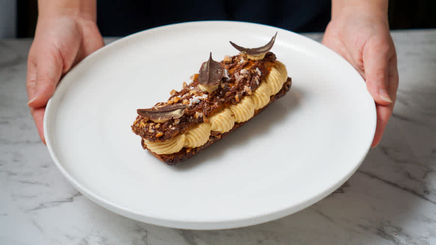 holding-ferrero-eclair-on-plate