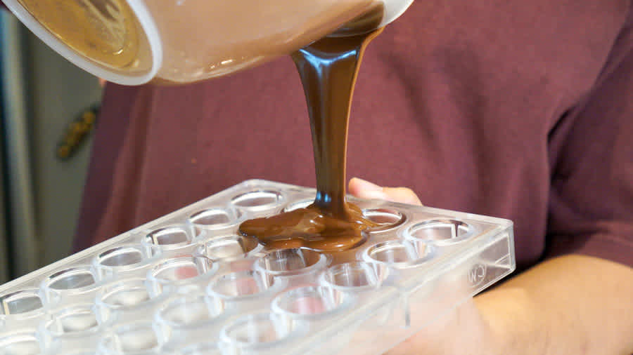 pouring-tempered-chocolate-into-mold