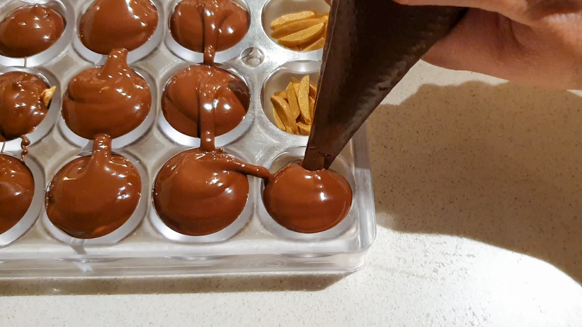 piping-tempered-chocolate-into-moulds