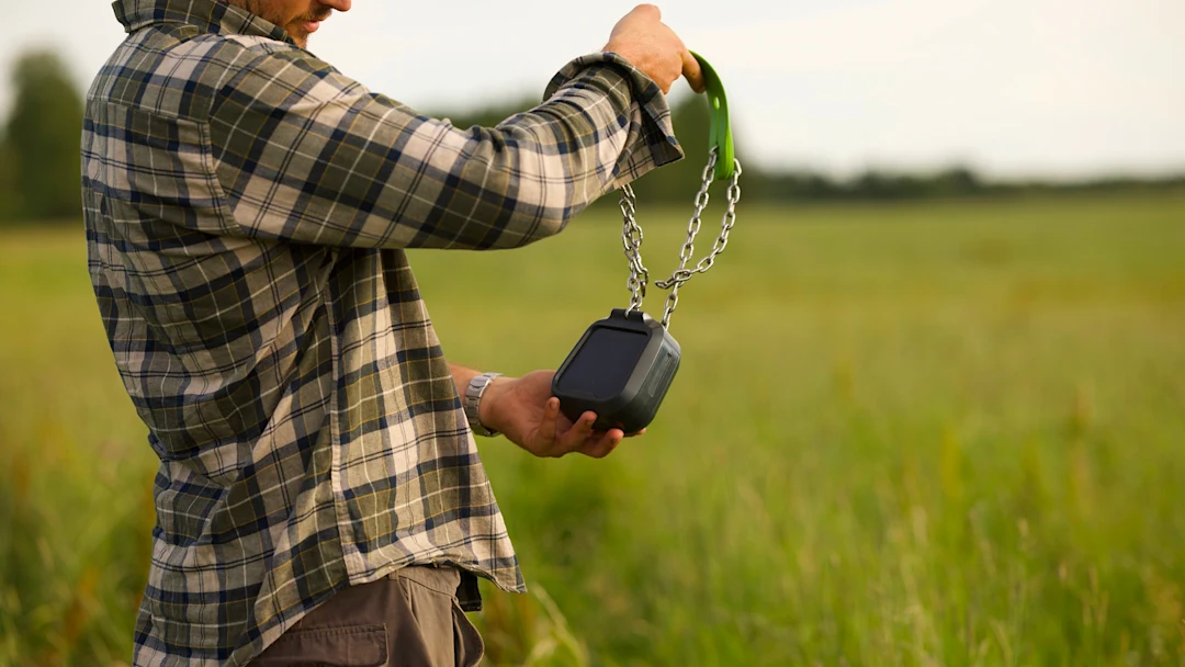 Farmer holding N3 collar