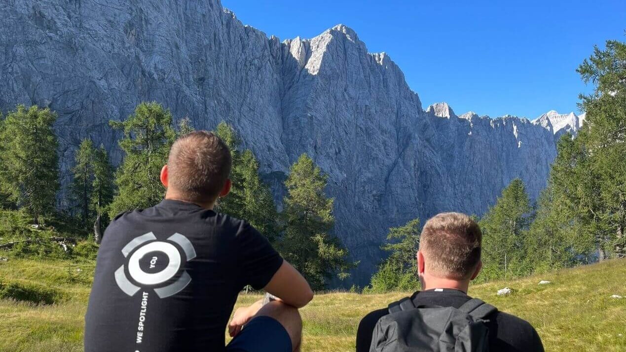 Mountains view with the higroup employee brand shirt