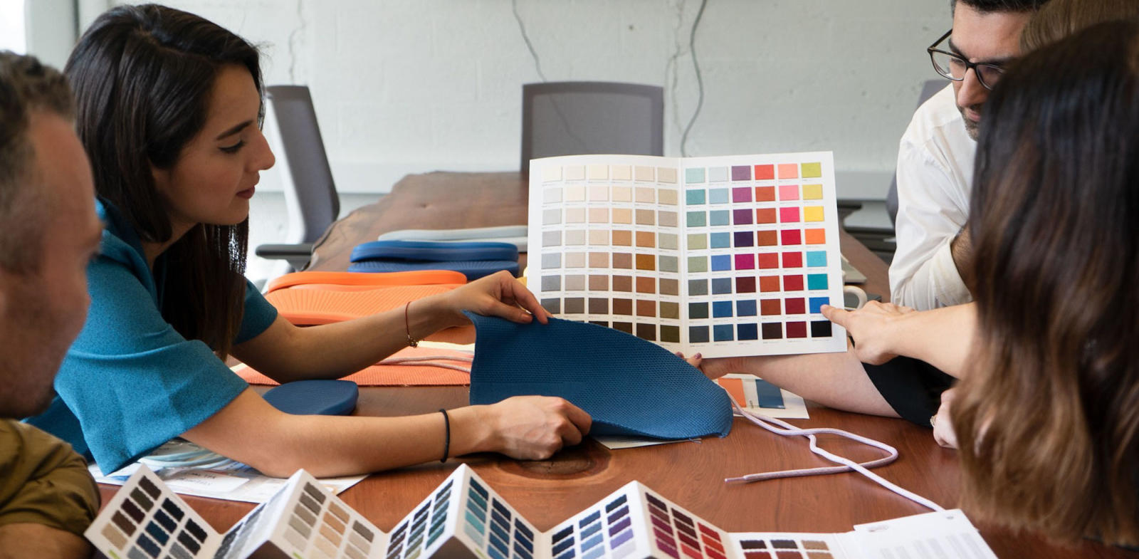 product meeting at Allbirds, people comparing a color chart