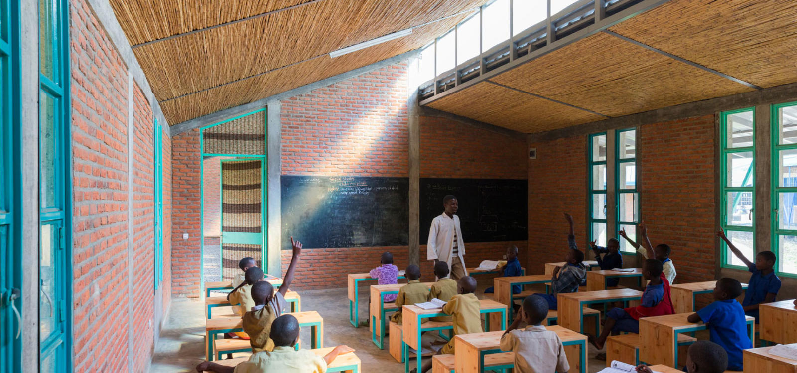Students studying in a classroom designed to minimize direct sunlight in Rwanda