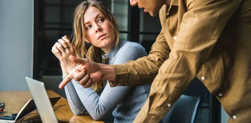 business people talking over a laptop, okr conversation