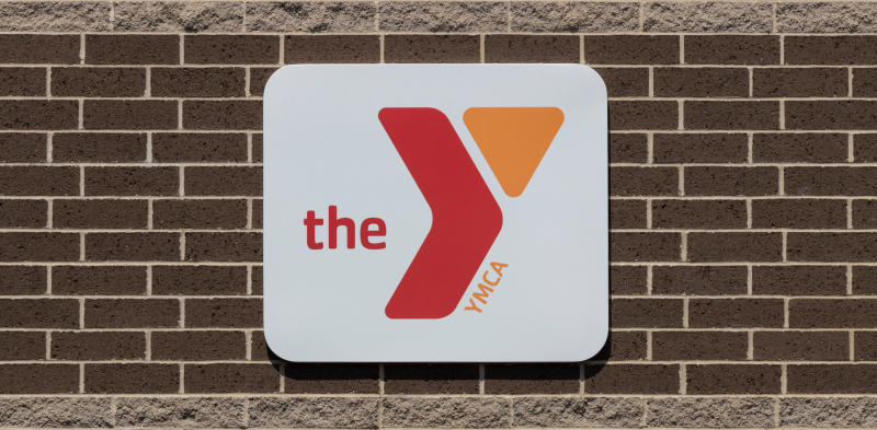 the Y sign on a brick wall