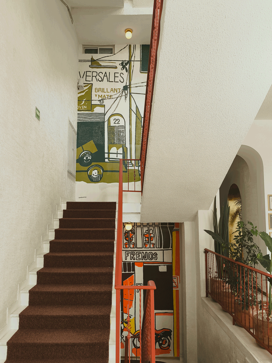 undefined undefined : Turning the corner from the first to the second floor, you are greeted by the next mural in the triptych, ‘Muro Verde,’ inviting you to explore further.
