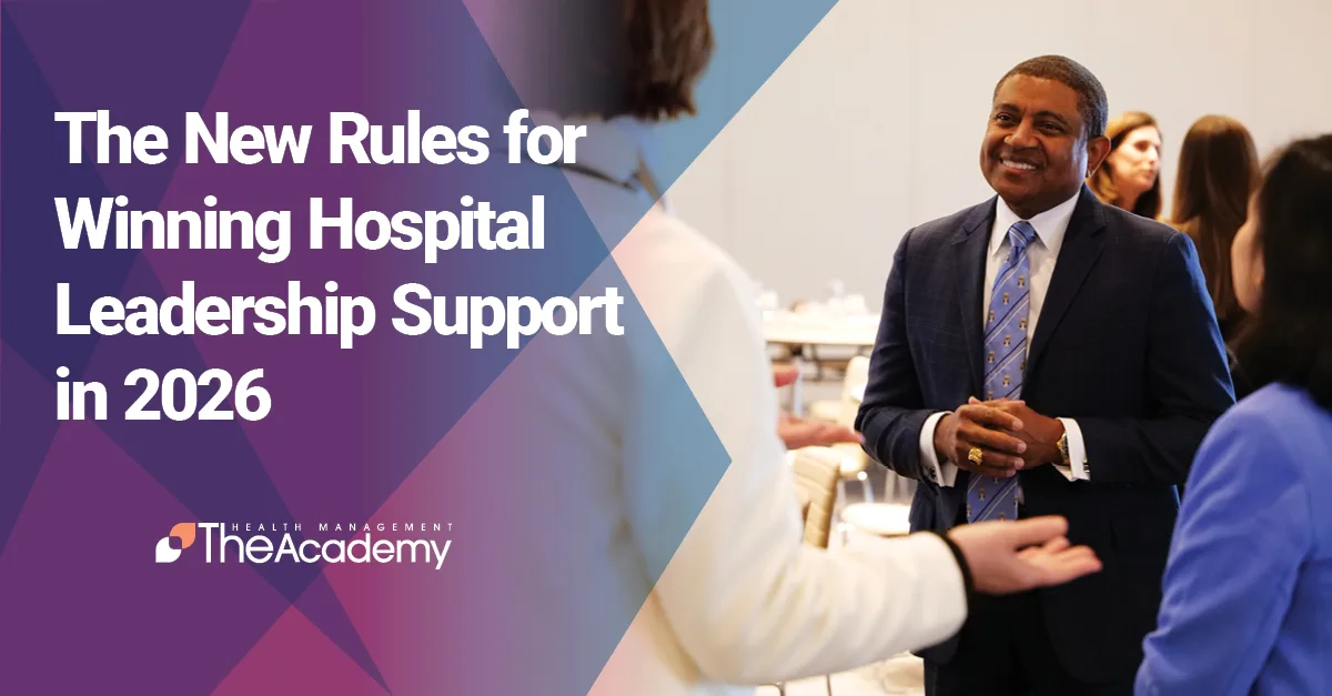 A smiling health system executive engaged in a strategic conversation with industry partners to illustrate winning hospital leadership support in 2026.