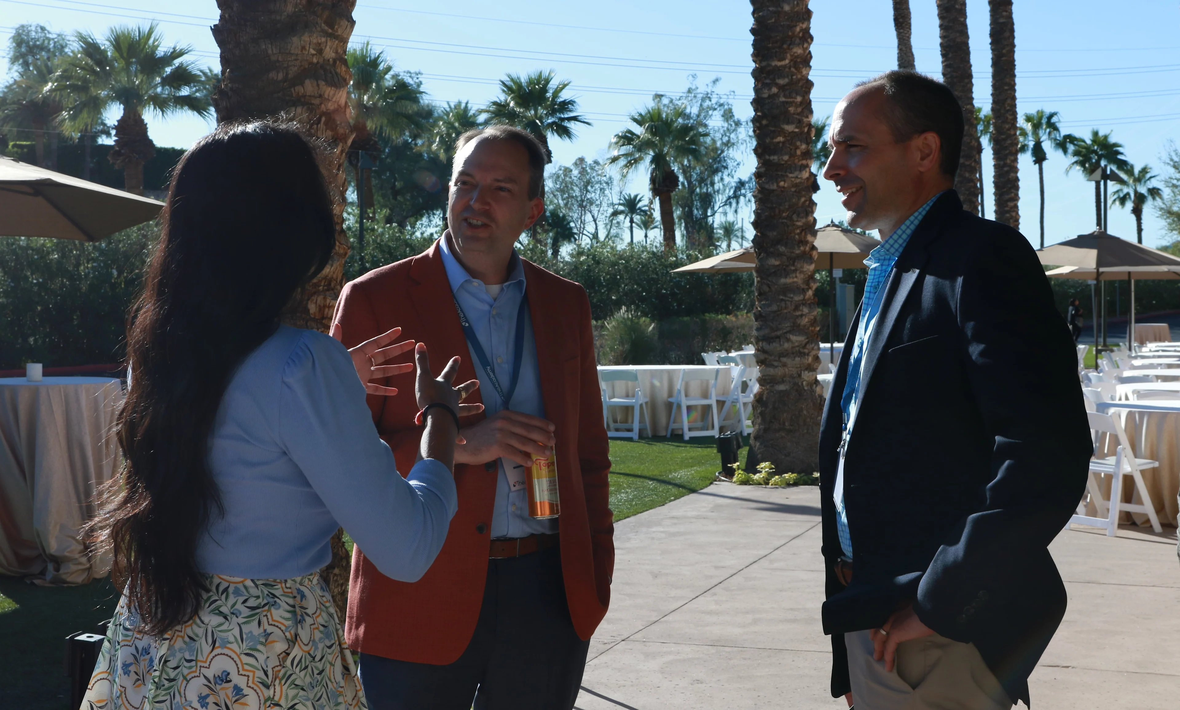 Attendees of the VP of Finance Forum gathered outdoors socializing.