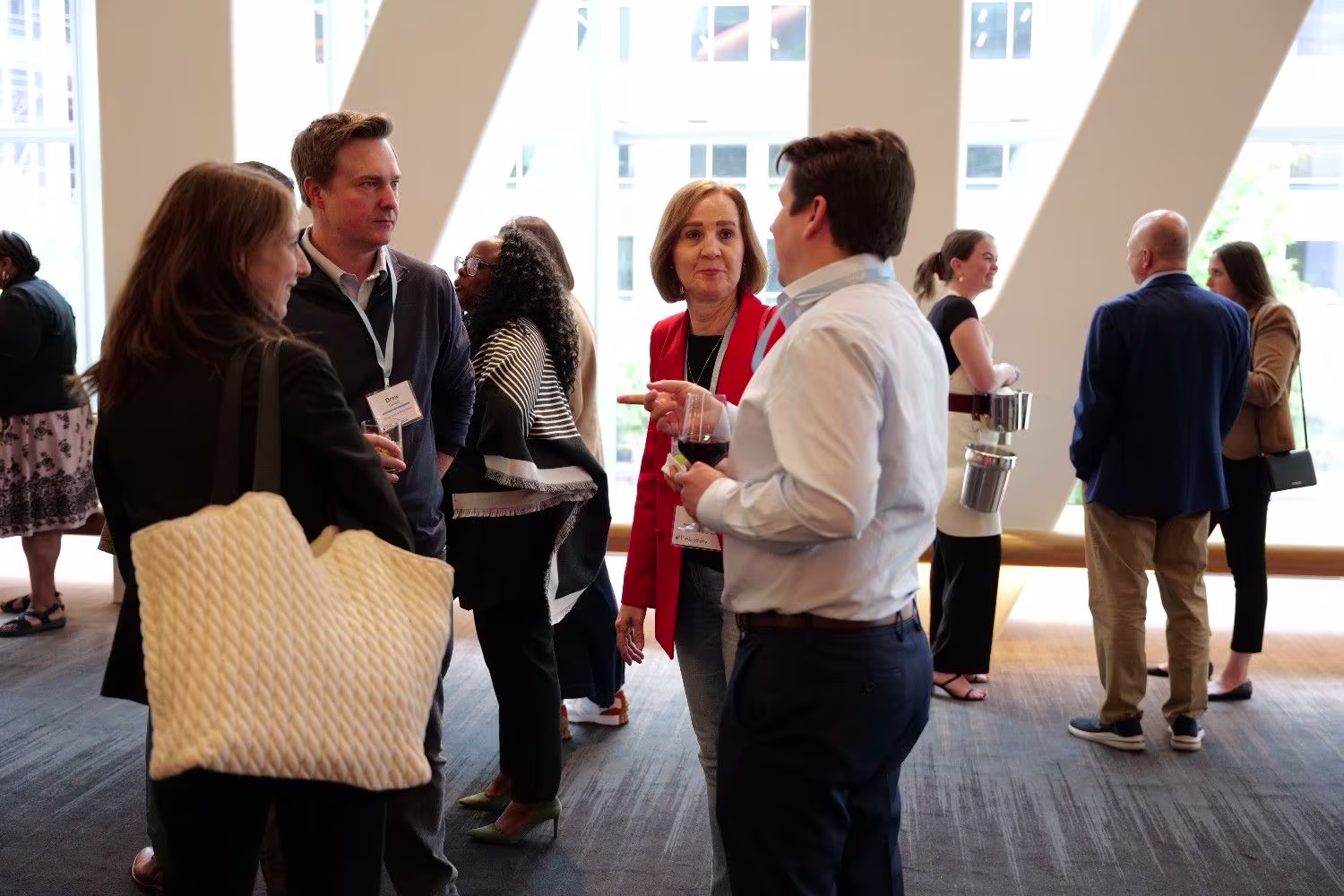 Group of healthcare executives engaged in collaborative healthcare networking conversation