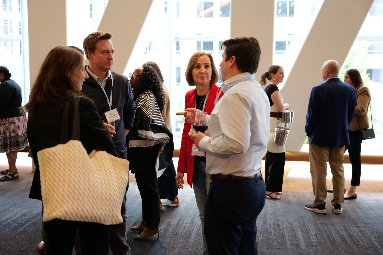 Group of healthcare executives engaged in collaborative healthcare networking conversation