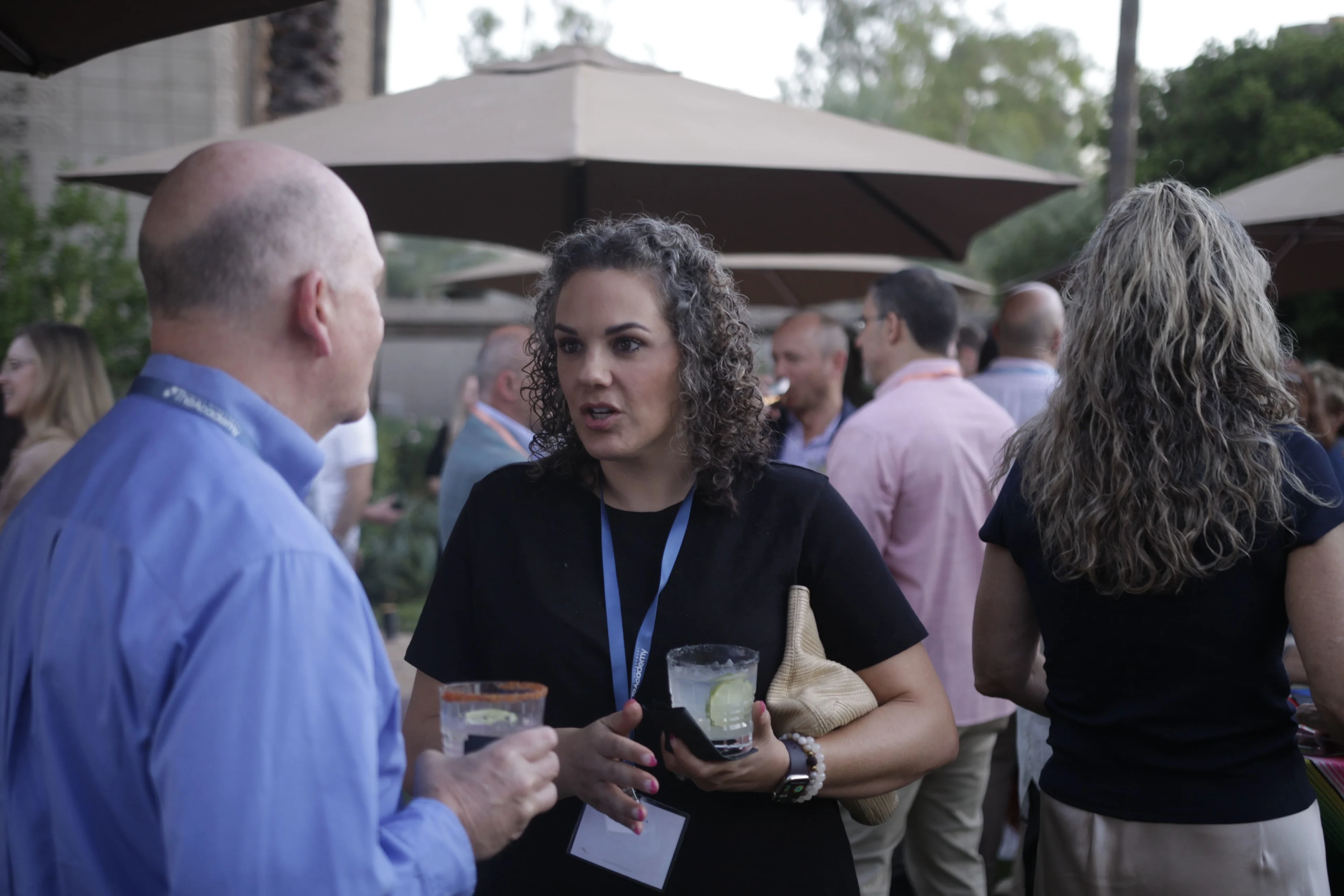 Health system and healthcare industry executives talk during one of THMA's healthcare analytics conferences