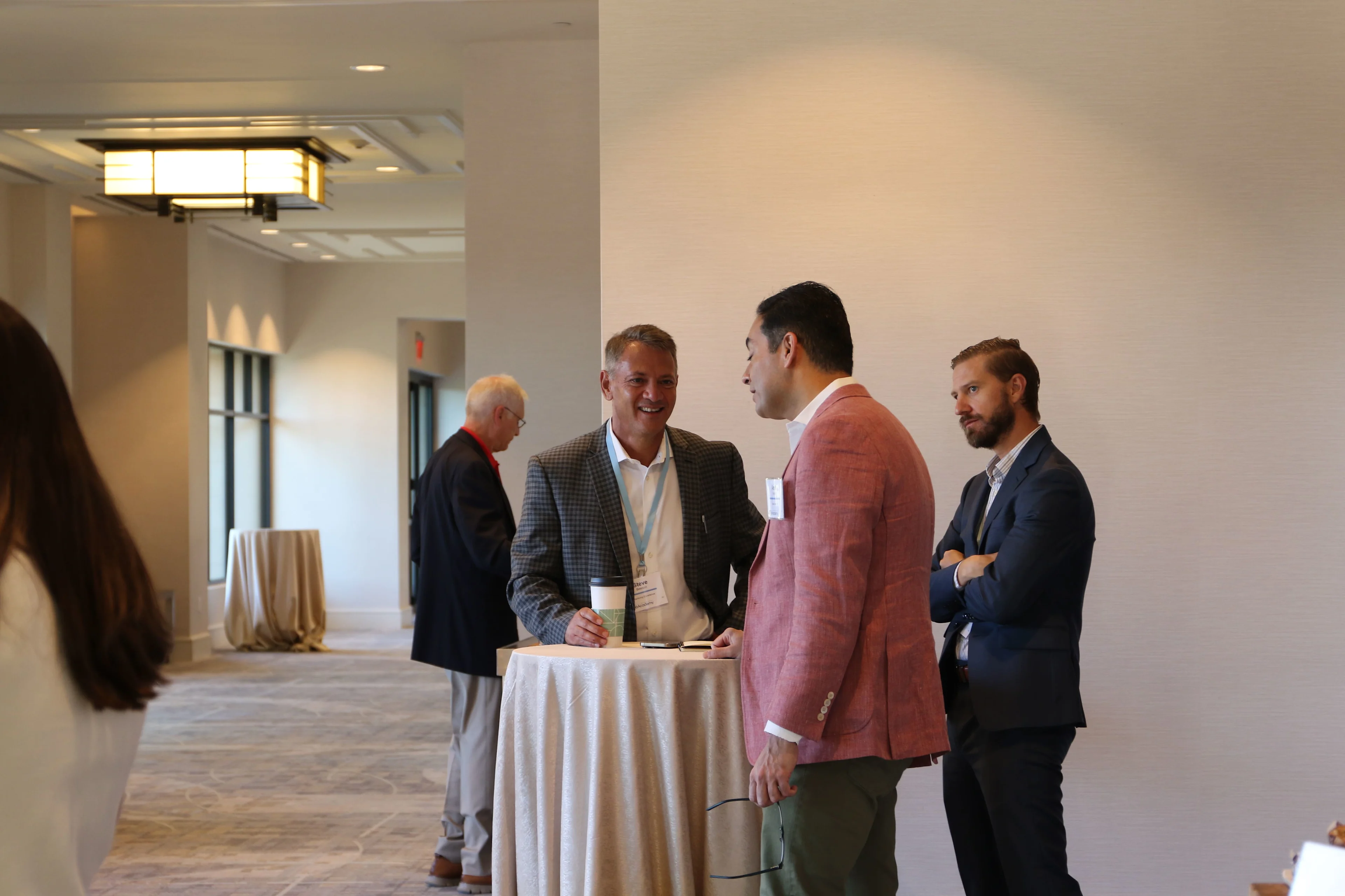 Healthcare executives discussing donor strategy at a philanthropy healthcare leadership conference.